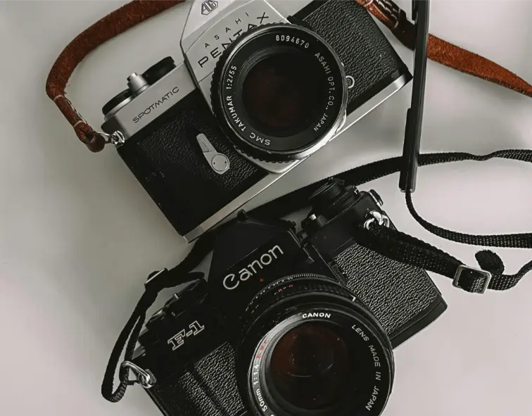 Photo by Ahmet Cantürk httpswww.pexels.comphotodslr-cameras-on-a-white-surface-11945573