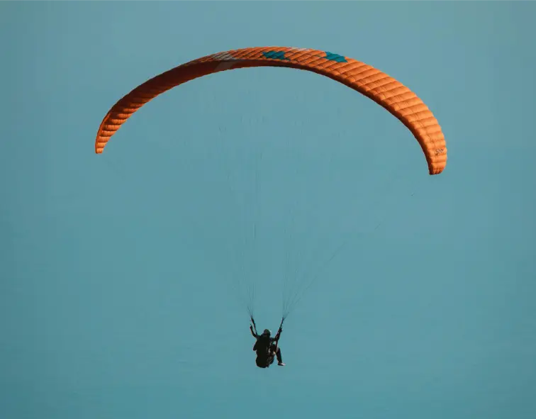 Photo by Ali httpswww.pexels.comphotoparaglider-soaring-in-clear-blue-sky-32800968
