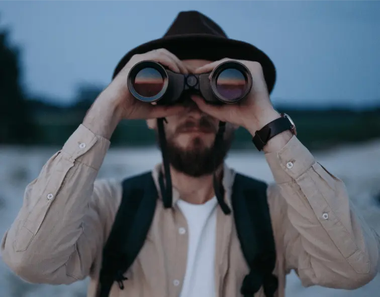Photo by Pavel Danilyuk httpswww.pexels.comphotoa-bearded-man-with-a-hat-using-binoculars-9143804